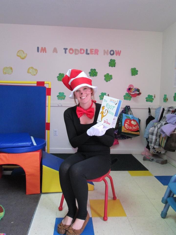 Teacher reading with a young child at Apple Blossoms Child Center